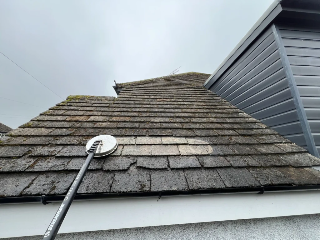 Close-up of a roof cleaning process