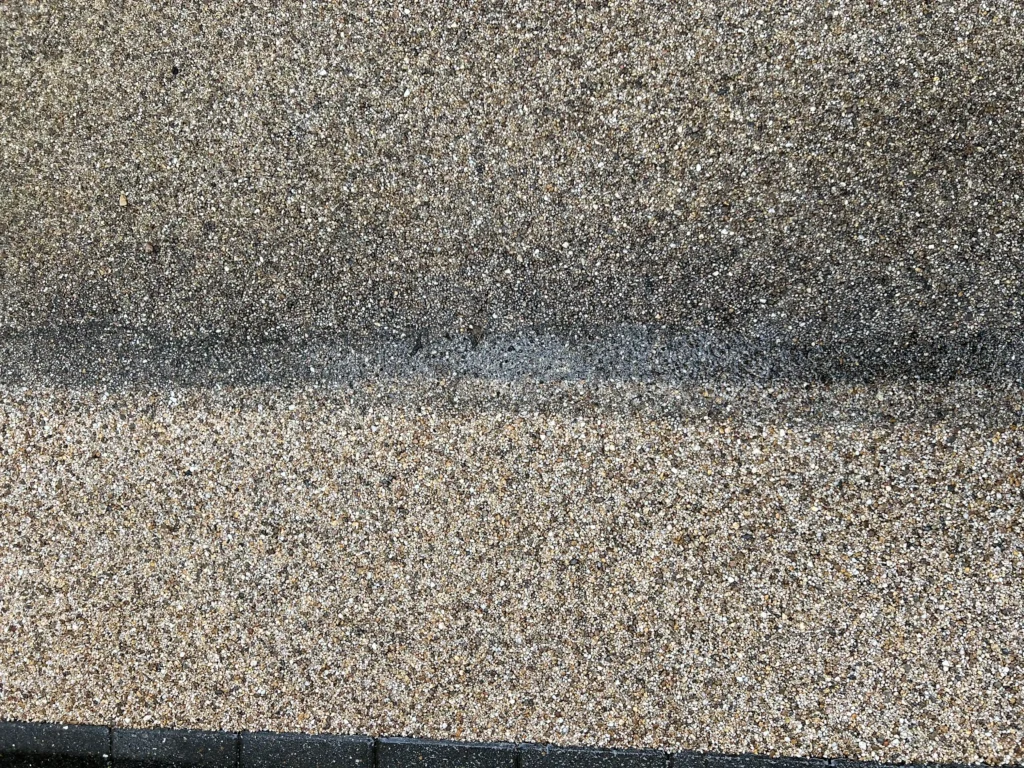 Image of a rough, pebble-dashed surface